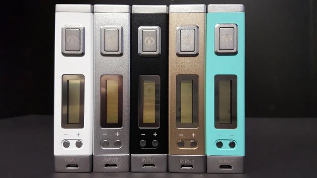 A sleek pod juice oxbar device with gradient finish, showcasing its compact form factor against an Australian backdrop